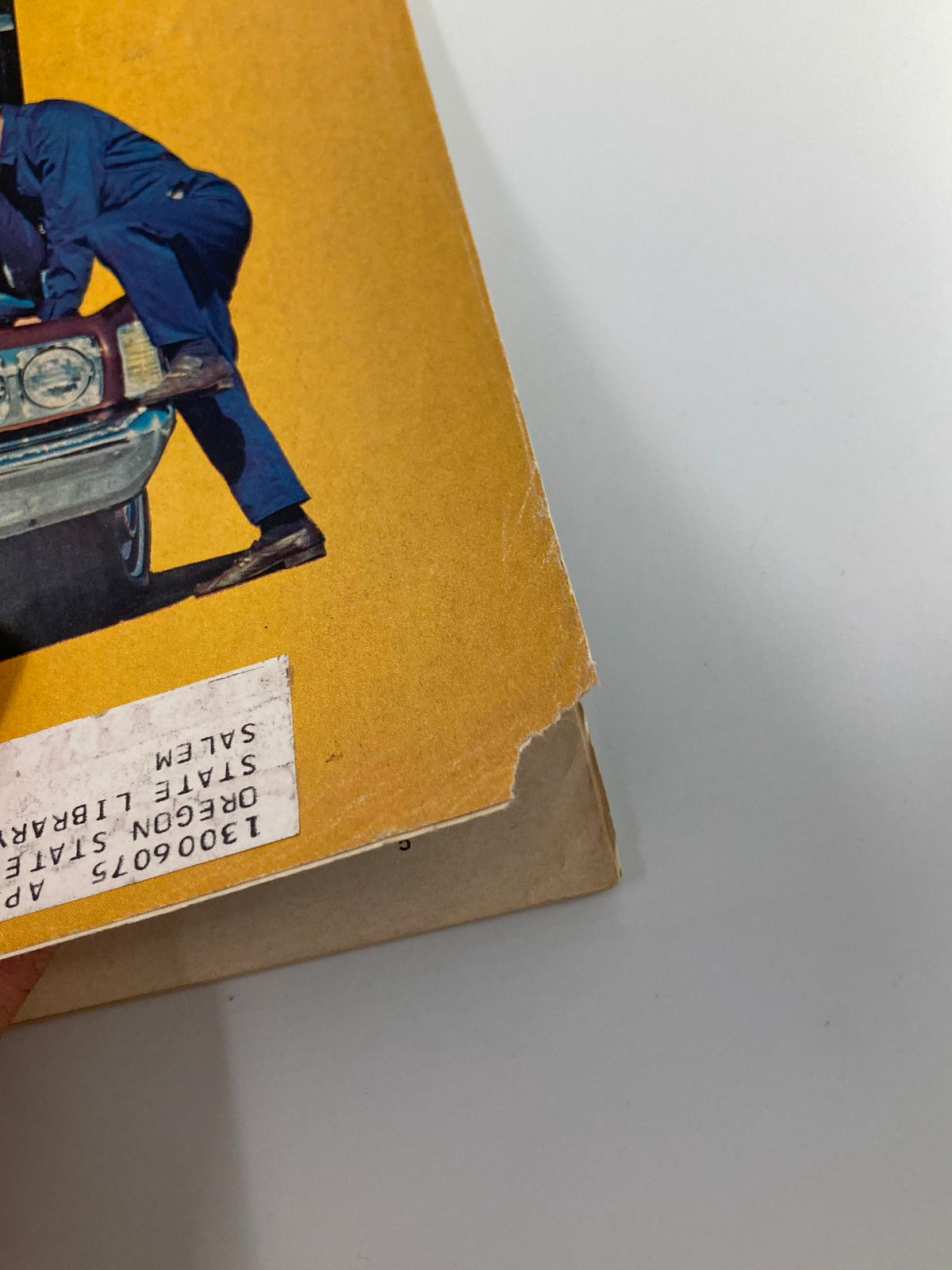 Side view of the VTG Forbes Magazine December 1 1973 cover, showing minor wear and a library sticker while retaining the title 'When Gas is Gold: Chrysler vs American Motors'.