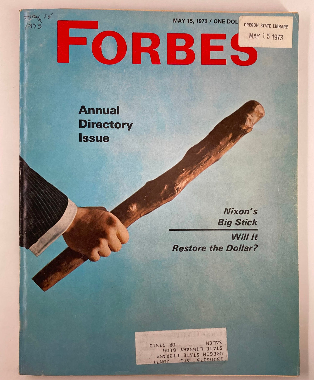 Cover of Forbes Magazine May 15, 1973, featuring a man's hand holding a large stick with the title 'Richard Nixon's Big Stick: Will It Restore the Dollar?' and a blue background.