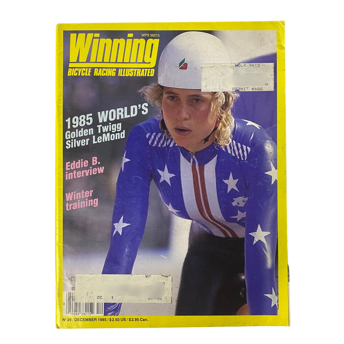 Cover of Winning Bicycle Racing Illustrated, December 1985, featuring Rebecca Twigg in a racing helmet, highlighting her accomplishments and the magazine's focus on cycling during that era.