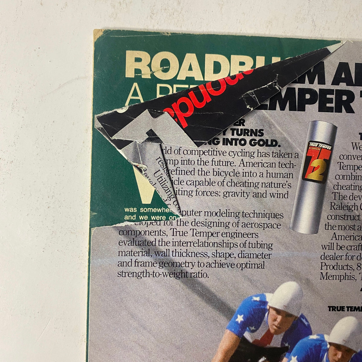 Close-up of the back cover of Winning Bicycle Racing Illustrated, April 1985, No. 21, showcasing an advertisement and some wear, reflecting its vintage appeal.