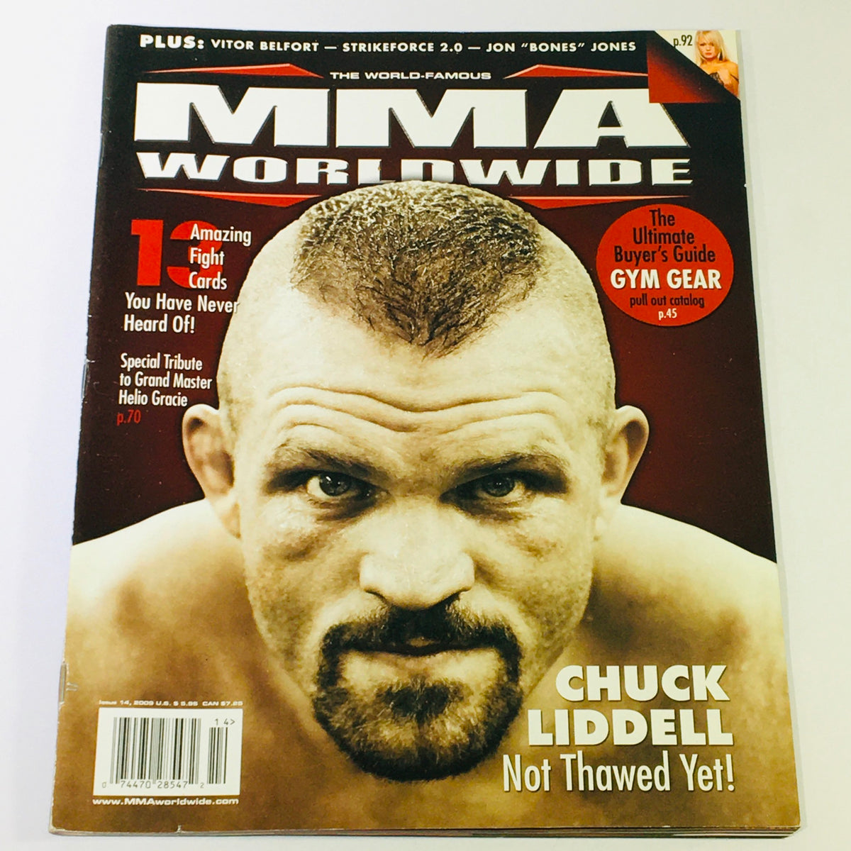 Cover of MMA Worldwide Magazine 2009 #14 featuring Chuck Liddell, a prominent MMA fighter, prominently displayed with a serious expression. The magazine highlights significant events in mixed martial arts and includes mentions of Grand Master Helio Gracie.