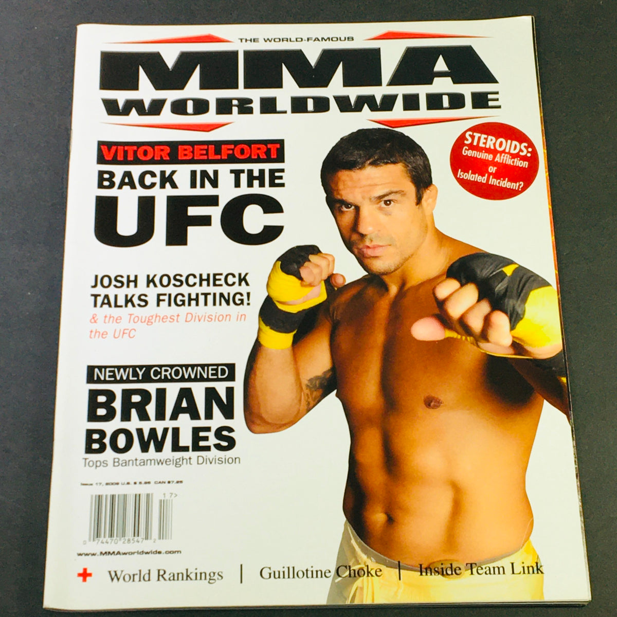 MMA Worldwide Magazine 2009 #17 featuring Josh Koscheck in a fighting pose with Brian Bowles highlighted as the newly crowned Bantamweight champion, showcasing the cover design and promotional content of mixed martial arts.