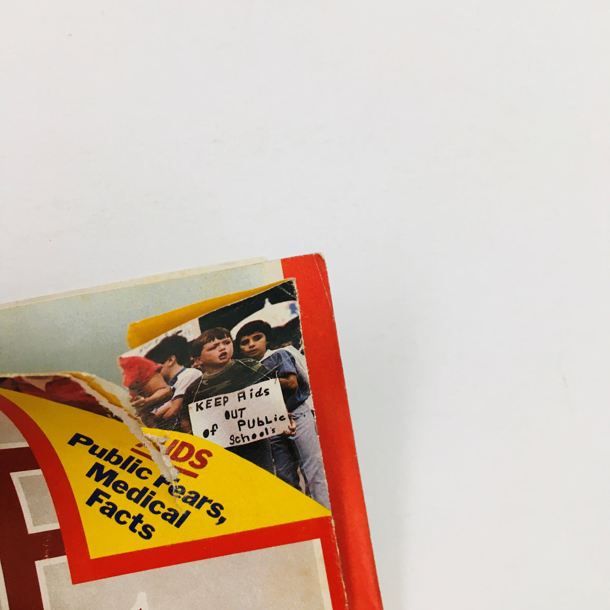 Image showing the upper corner of the Time Magazine from September 23, 1985, displaying a protest image with the message 'KEEP Aids OUT of Public Schools', illustrating the era's social issues alongside Deng Xiaoping's political narrative.