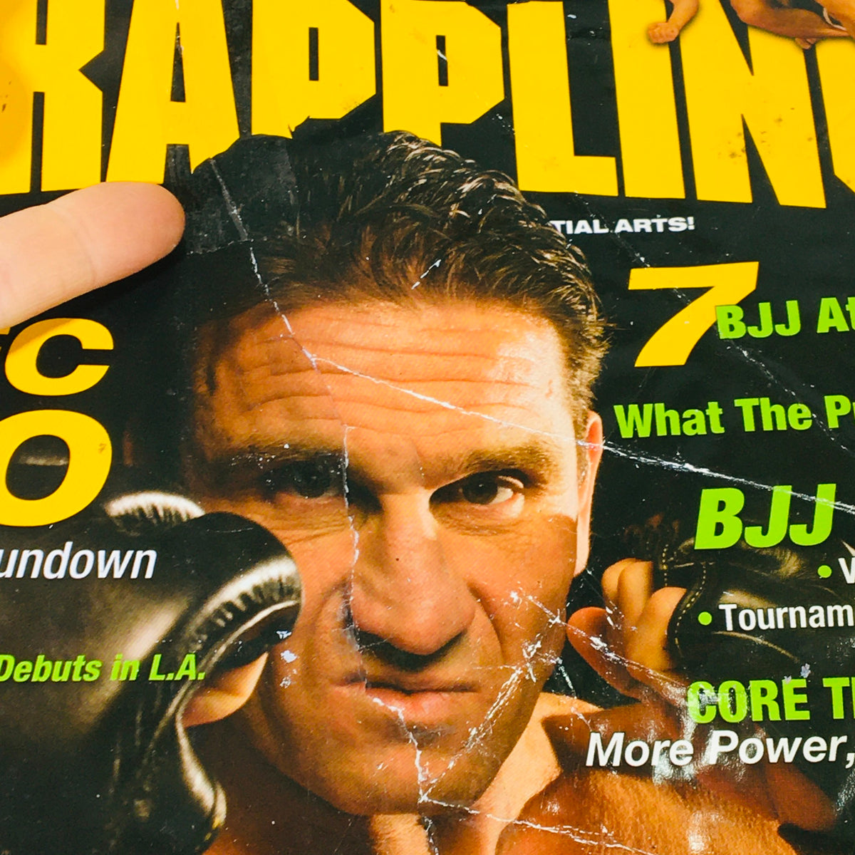 Close-up of the Ultimate Grappling MMA Magazine August 2006 cover showing Ken Shamrock with noticeable wear and tear.