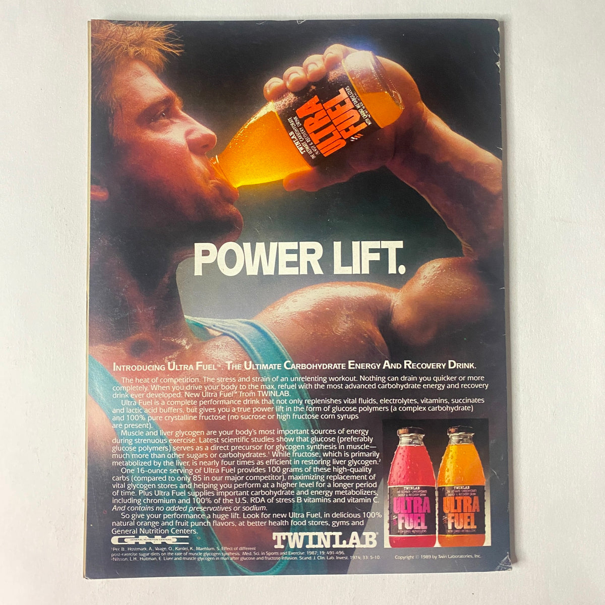 Back cover of IronMan Magazine January 1990 Vol 49 No. 1 featuring advertisement for Ultra Fuel, an energy and recovery drink; emphasizes 'POWER LIFT' with images of the drink, showcasing its appeal in the fitness community.