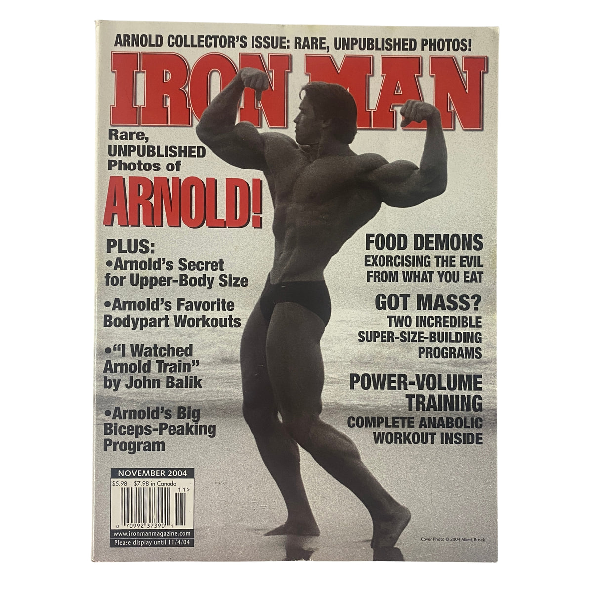 IronMan Magazine November 2004 featuring Arnold Schwarzenegger on the cover, showcasing bodybuilding heritage with a striking image of a muscular man posing. This collector's issue highlights rare, unpublished photos and iconic training philosophies of Arnold Schwarzenegger.