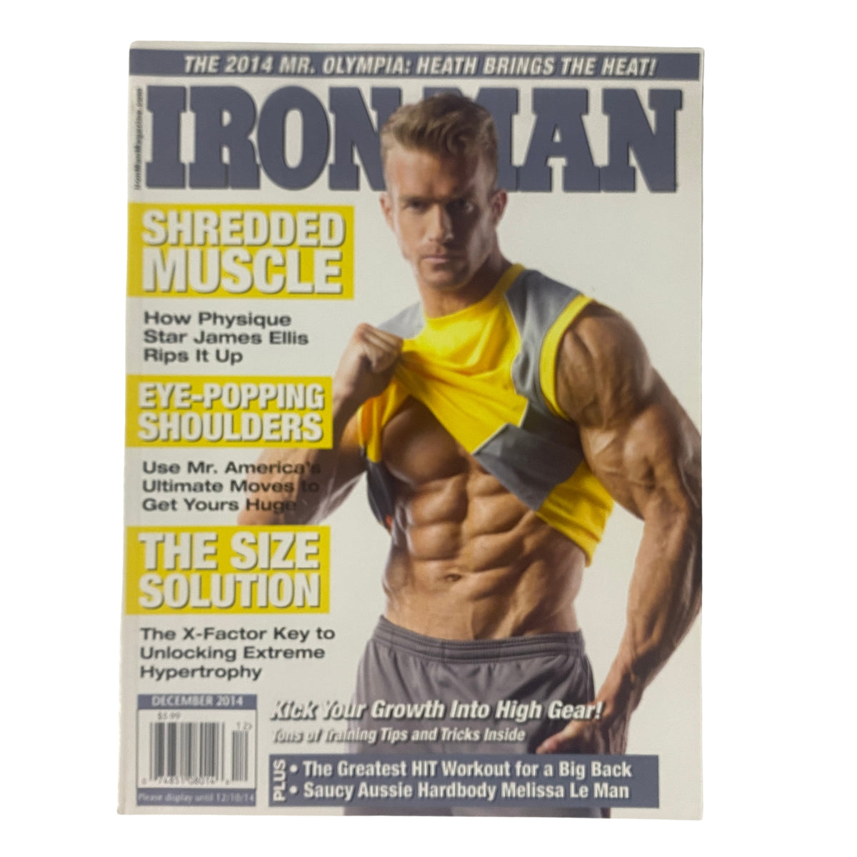 IronMan Magazine December 2014 cover featuring James Ellis showcasing a muscular physique with the headline 'Shredded Muscle'. This issue includes articles on hypertrophy, shoulders, and weight training.