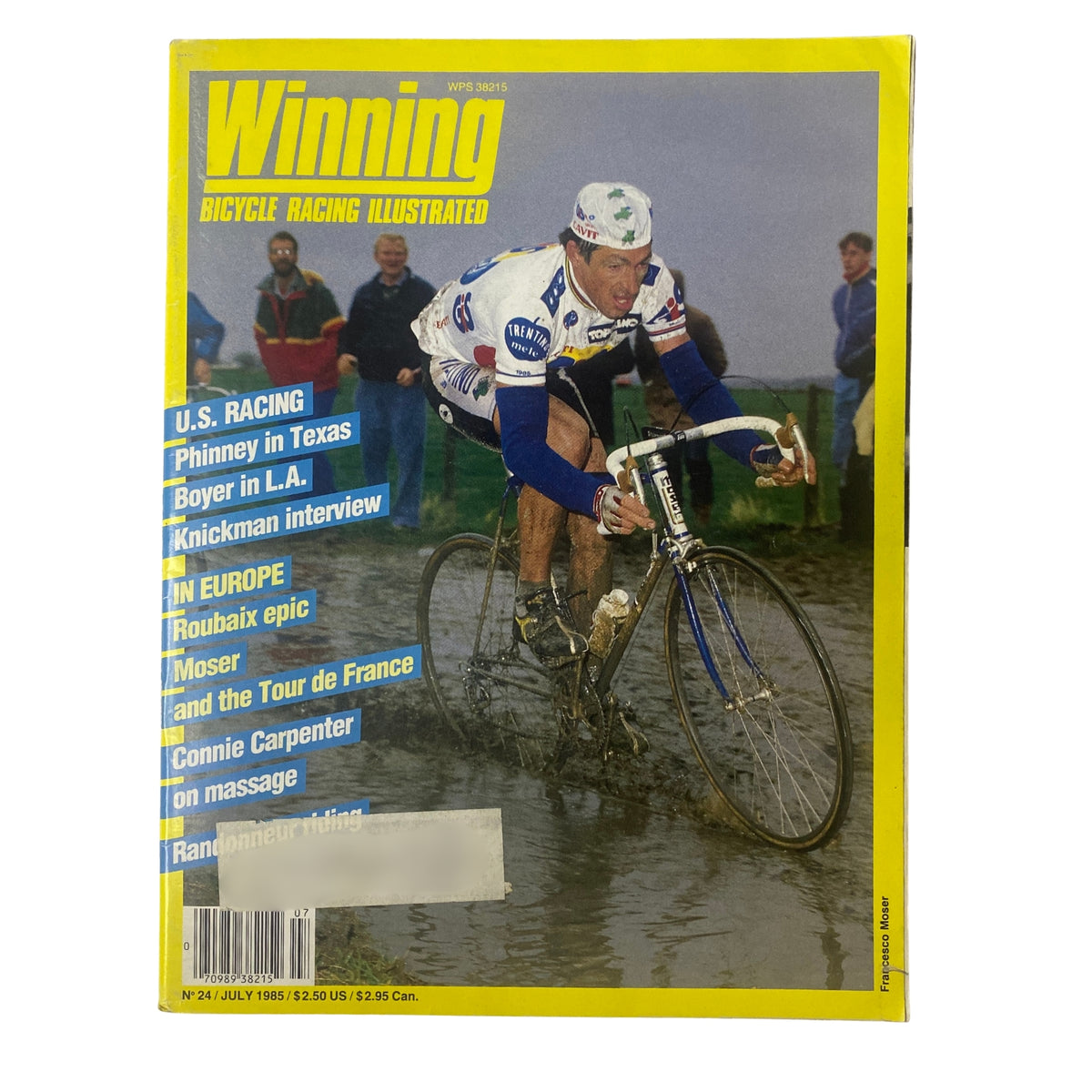 Cover of Winning Bicycle Racing Illustrated, July 1985, No. 24 featuring Francesco Moser racing in wet conditions, highlighting U.S. racing and European cycling events.
