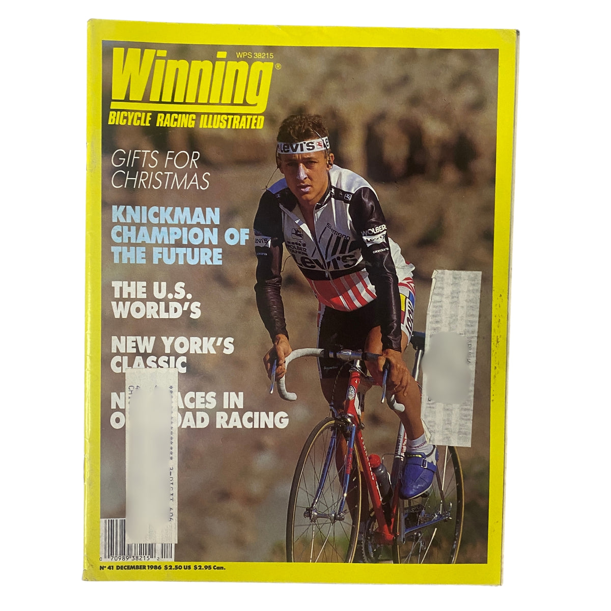 Cover of Winning Bicycle Racing Illustrated from December 1986, featuring Roy Knickman in bicycle racing apparel, showcasing a dynamic moment in cycling, with a vibrant yellow background. This issue (No. 41) includes topics on Phil Anderson, Luis Herrera, and John Tomac's achievements in cycling.