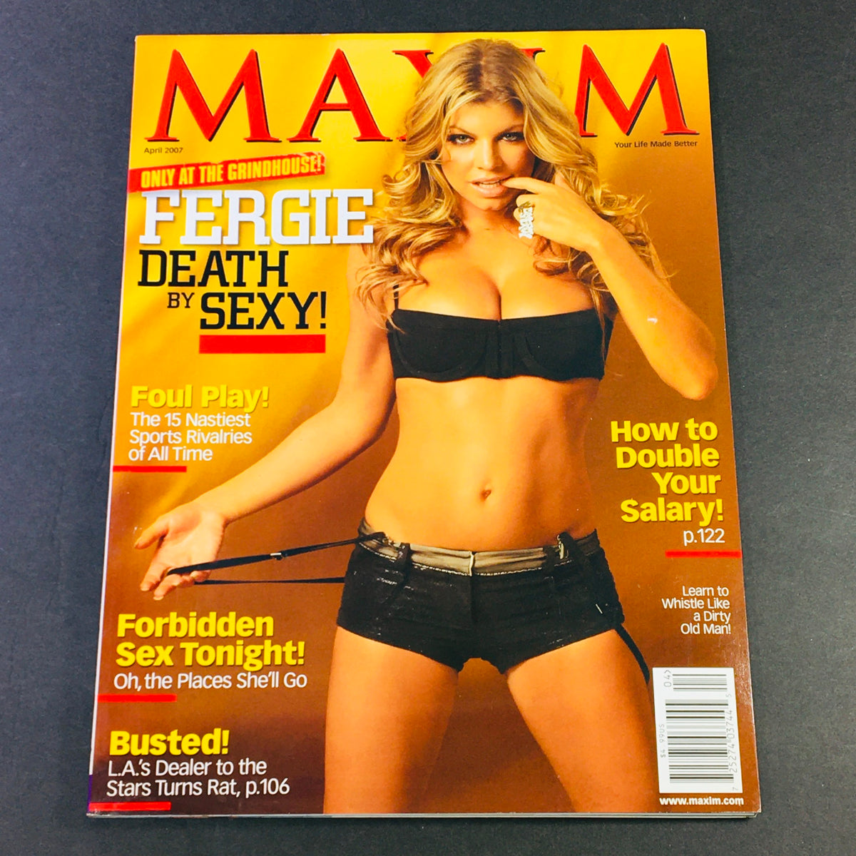 Maxim Magazine April 2007 cover featuring Fergie with the headline 'Death by Sexy'. The cover highlights articles including 'Forbidden Sex Tonight' and 'How to Double Your Salary!' with a vibrant background and a stylish pose.