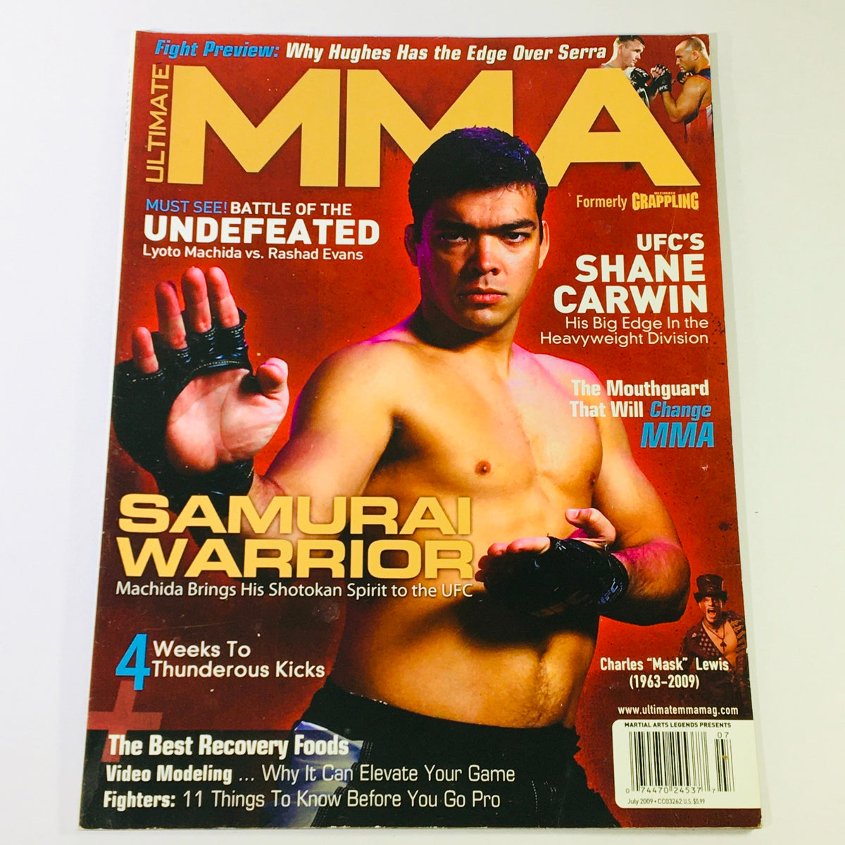 Ultimate MMA Magazine July 2009 featuring UFC's Shane Carwin, cover art showcasing mixed martial arts, with headlines about significant UFC matchups and fighters.