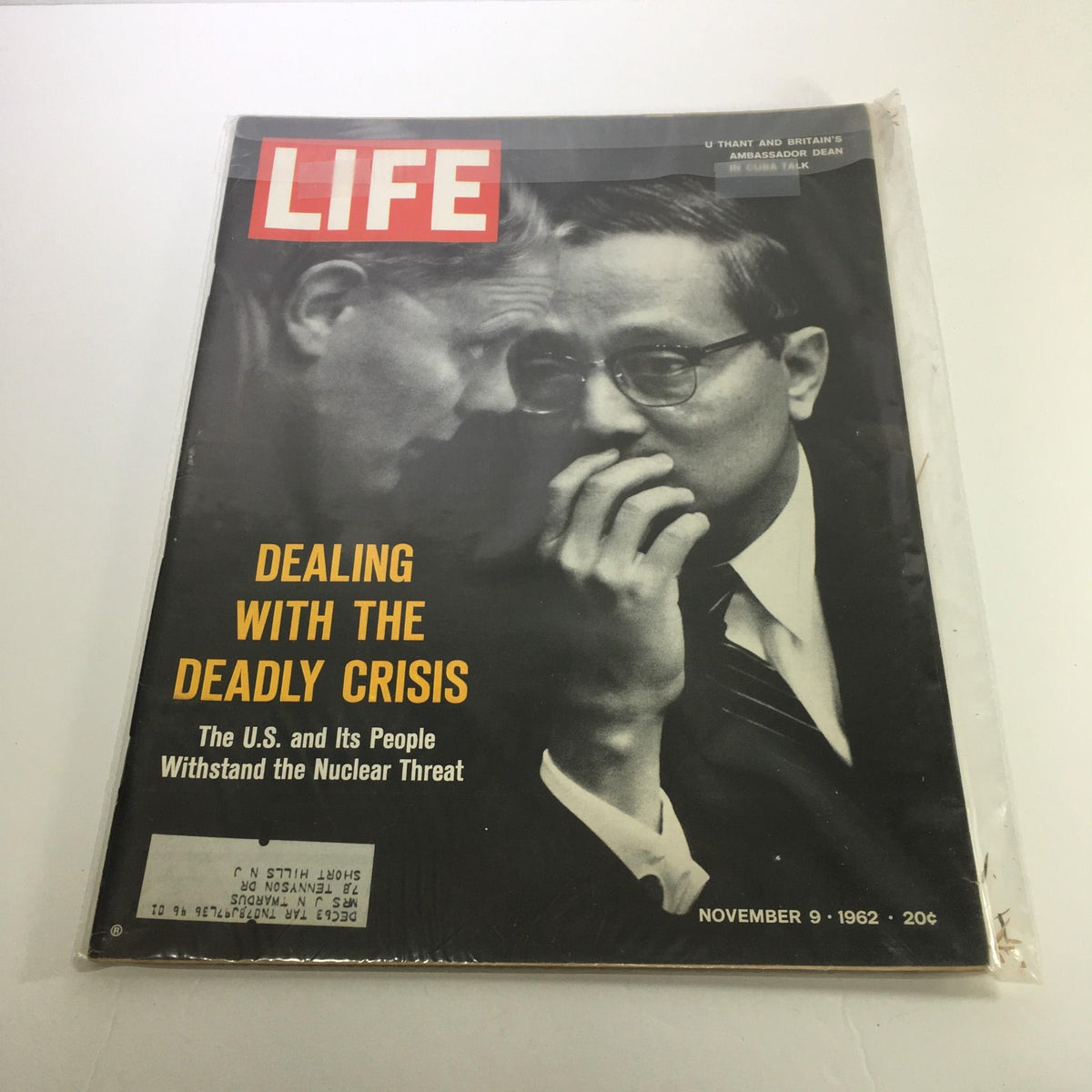 Cover of Life Magazine from November 9, 1962, featuring the title 'Dealing with the Deadly Crisis: The U.S. and Its People Withstand the Nuclear Threat' highlighting historical concerns about nuclear warfare.