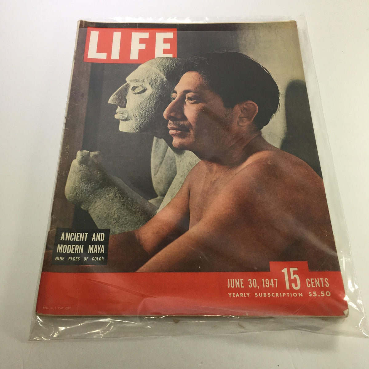 Cover of Life Magazine from June 30, 1947, featuring an insightful article on Ancient and Modern Maya, showcasing a man beside a stone statue, capturing the essence of Maya civilization.