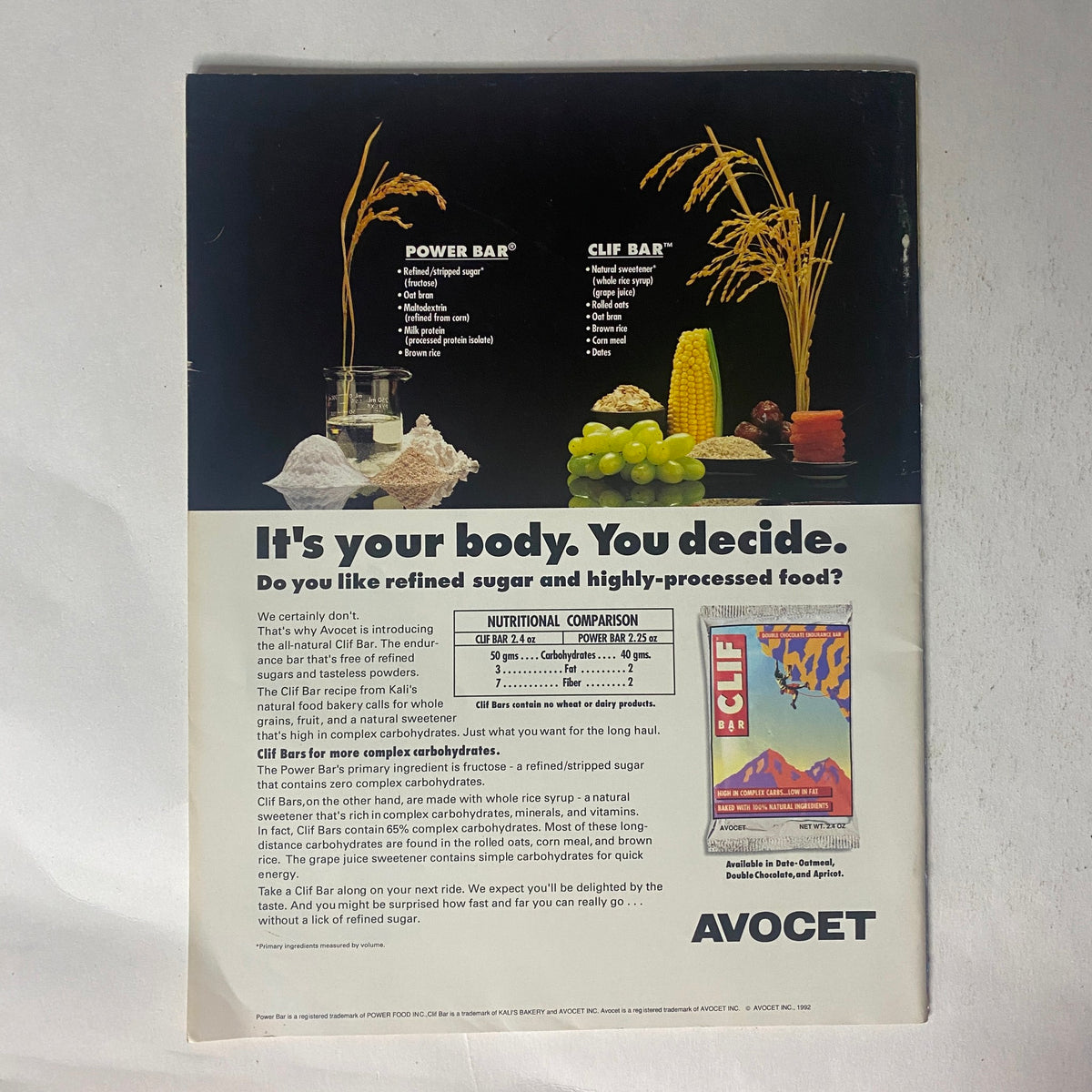 Back cover advertisement from Winning Bicycle Racing Illustrated, March 1992, promoting Power Bar and Clif Bar with nutritional comparison.