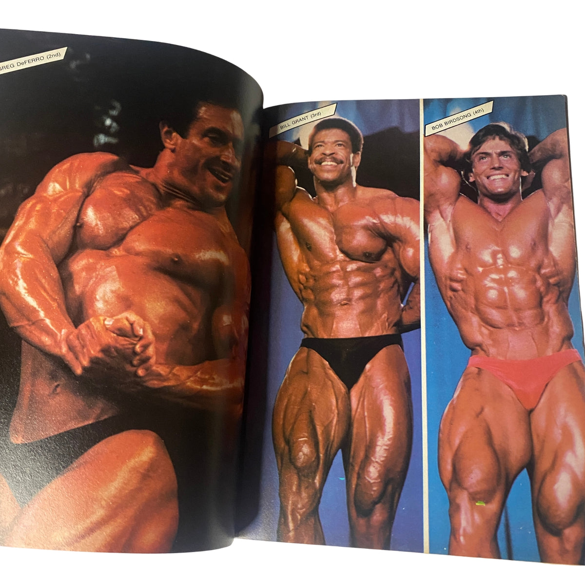 Centerfold image from Muscle & Bodybuilder Magazine September 1984 showcasing three bodybuilders in competitive poses.
