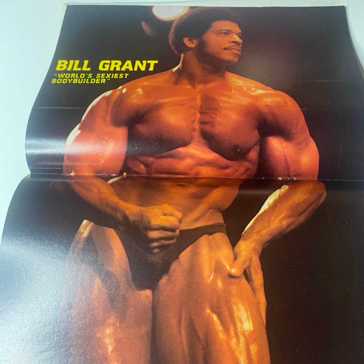 Centerfold of Muscle & Bodybuilder Magazine September 1981 featuring Bill Grant, famously known as the 'World's Sexiest Bodybuilder,' showcasing his muscular physique.