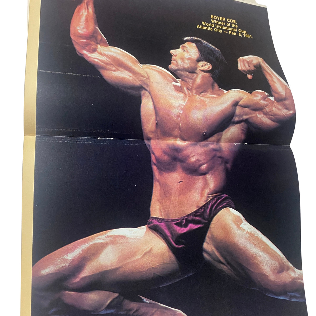 Centerfold image from Muscle World Magazine July 1981 Vol 2 No. 6, featuring bodybuilding legend Boyer Coe in a dramatic pose, showcasing his physique.