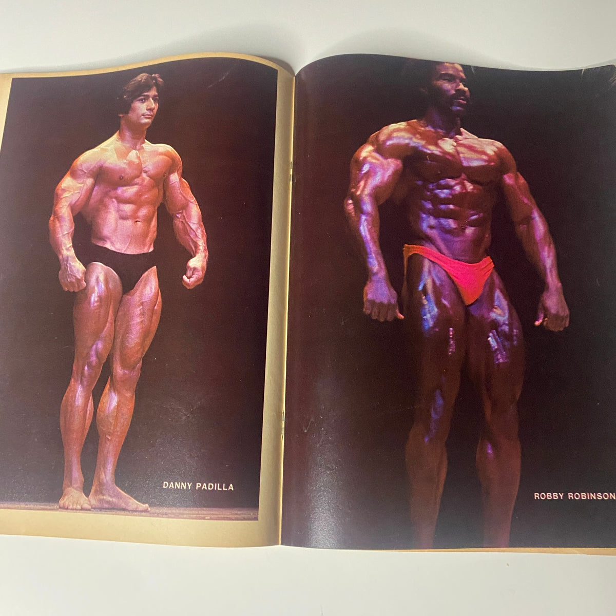 Centerfold of Bodybuilder Magazine from November 1979 showcasing side-by-side images of bodybuilders Danny Padilla and Robby Robinson.
