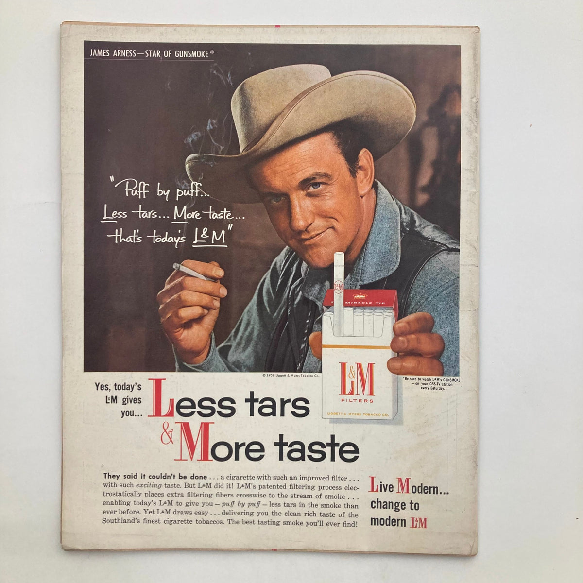 Back cover advertisement of vintage L&M cigarettes featuring James Arness from Gunsmoke, promoting 'Less tars... More taste... that's today's L&M'.
