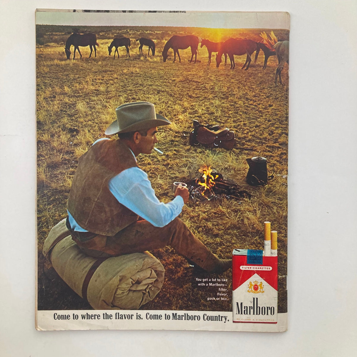 Back cover of VTG Look Magazine December 13 1966 showcasing a Marlboro advertisement with a cowboy by a campfire in Marlboro Country.