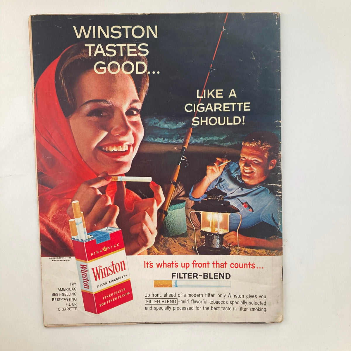 Advertisement page from VTG Look Magazine July 17 1962 featuring Winston cigarettes with a smiling woman and a man fishing, highlighting vintage marketing styles of the era.