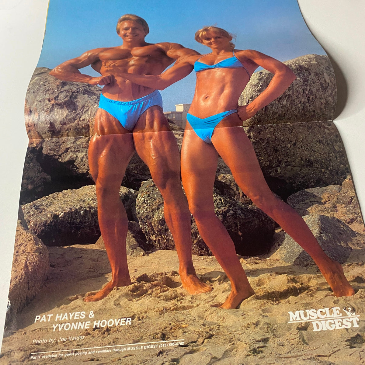 Centerfold from Muscle Digest Magazine February 1982 featuring bodybuilders Pat Hayes and Yvonne Hoover on the beach, showcasing fitness and physique.