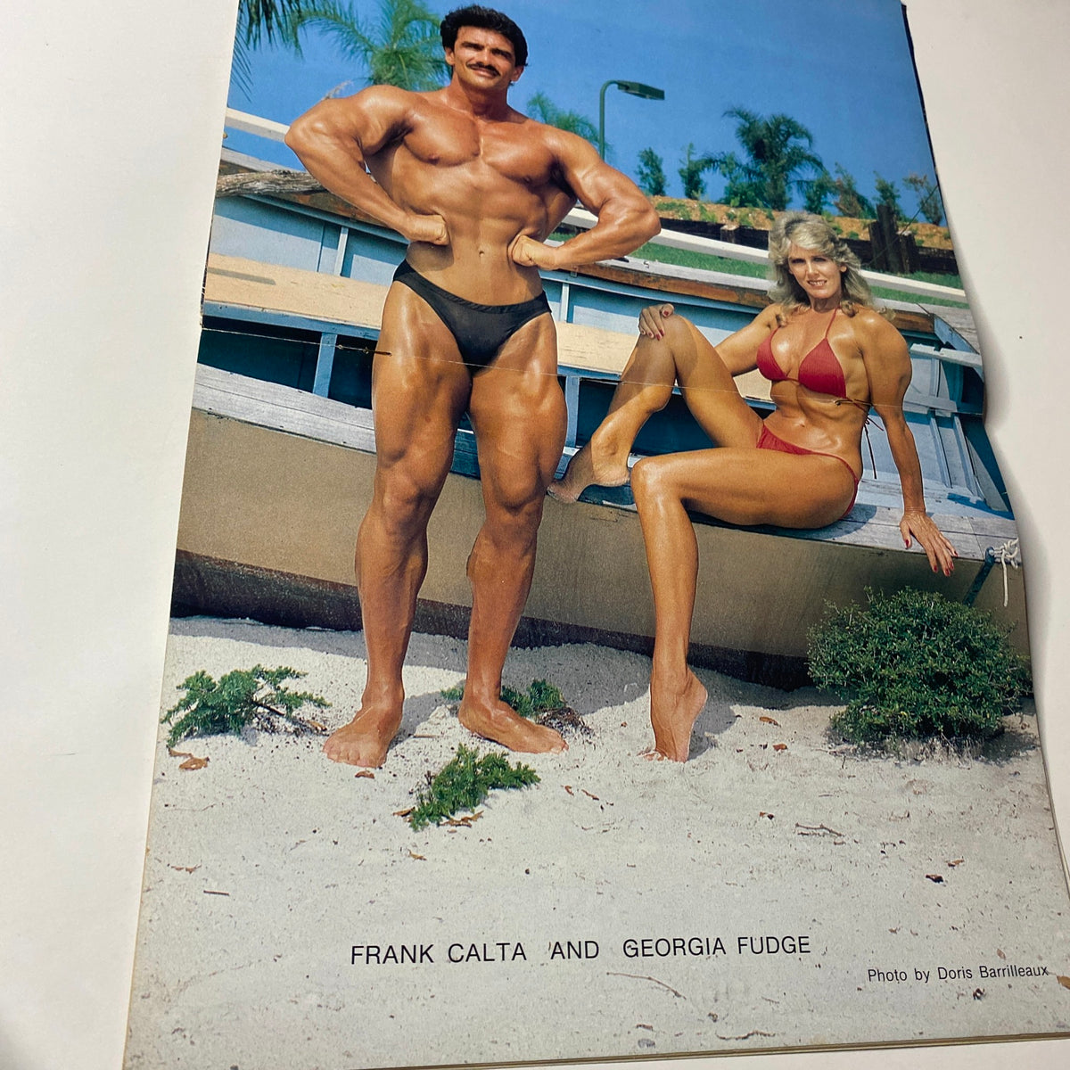 Centerfold from Muscle Digest Magazine September 1983 showing Frank Calta and Georgia Fudge, presenting a muscular couple in a fitness-themed setting.