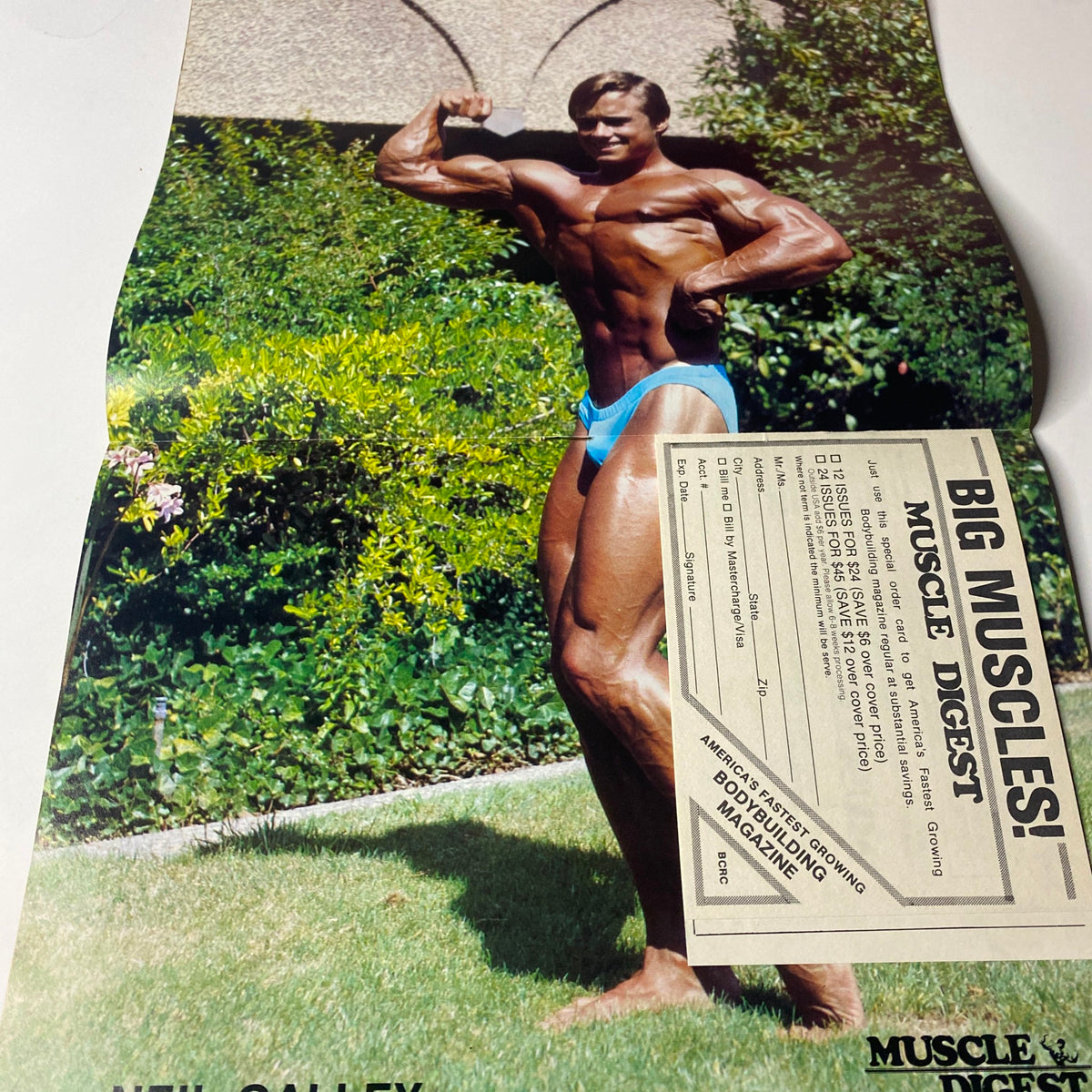 Centerfold image of Neil Galley from Muscle Digest Magazine May 1983 Vol 7 No. 5 showcasing his physique in a bodybuilding pose.