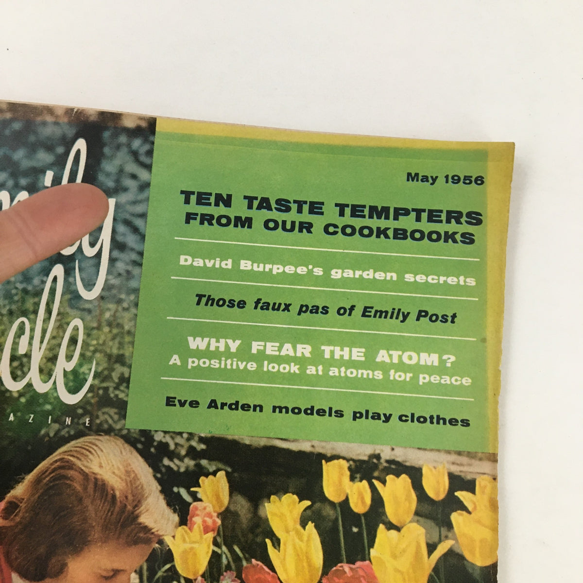 Close-up of the May 1956 Family Circle Magazine cover, showcasing the title and sections including David Burpee's gardening secrets, emphasizing family life and iconic 1950s themes.