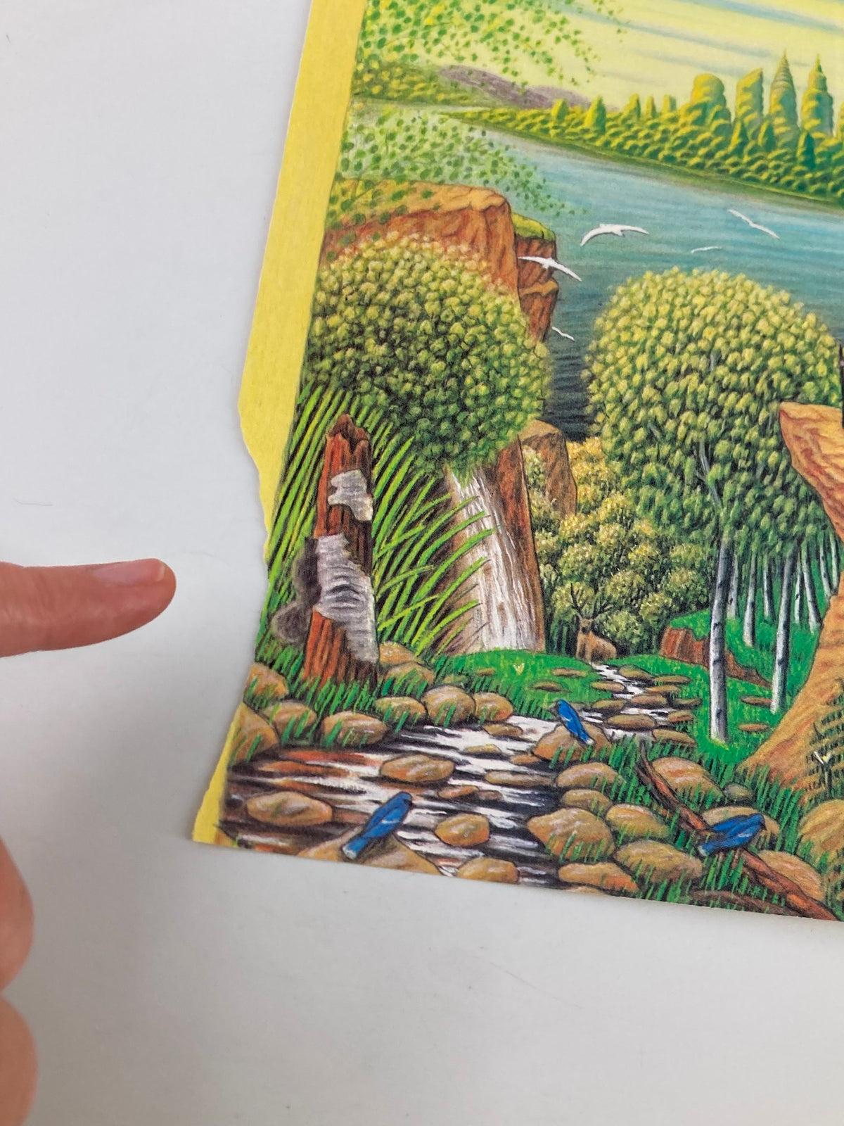 Detailed view of the cover art titled 'Painting Paradise' by Bob Knox for The New Yorker magazine, September 17, 1990. The image features lush greenery, a serene stream lined with rocks, and trees in vibrant colors, complemented by the artist's signature elements.