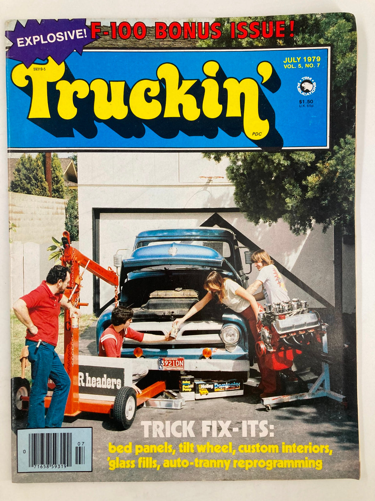 Cover of the July 1979 issue of Truckin' magazine featuring a blue F-100 truck and a team of mechanics working on its engine. This issue highlights truck modifications and automotive culture with the title 'VTG Truckin Magazine July 1979 F-100 Engine Switch at Brightly's Garage'.