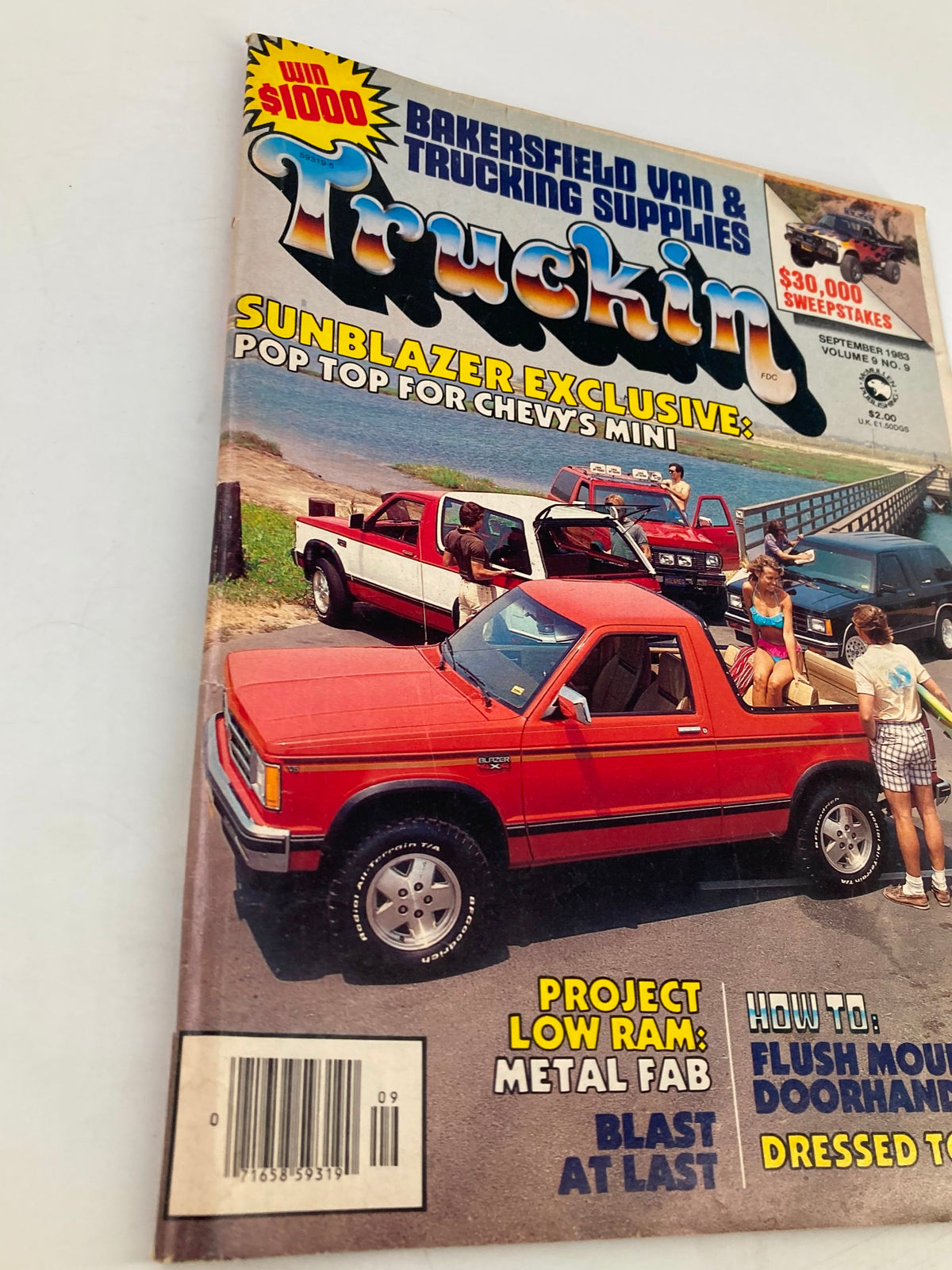 Another view of the VTG Truckin Magazine September 1983 cover, highlighting the Convertible Blazer by Flint Systems, with a red truck and beach scene, emphasizing vintage automotive design.