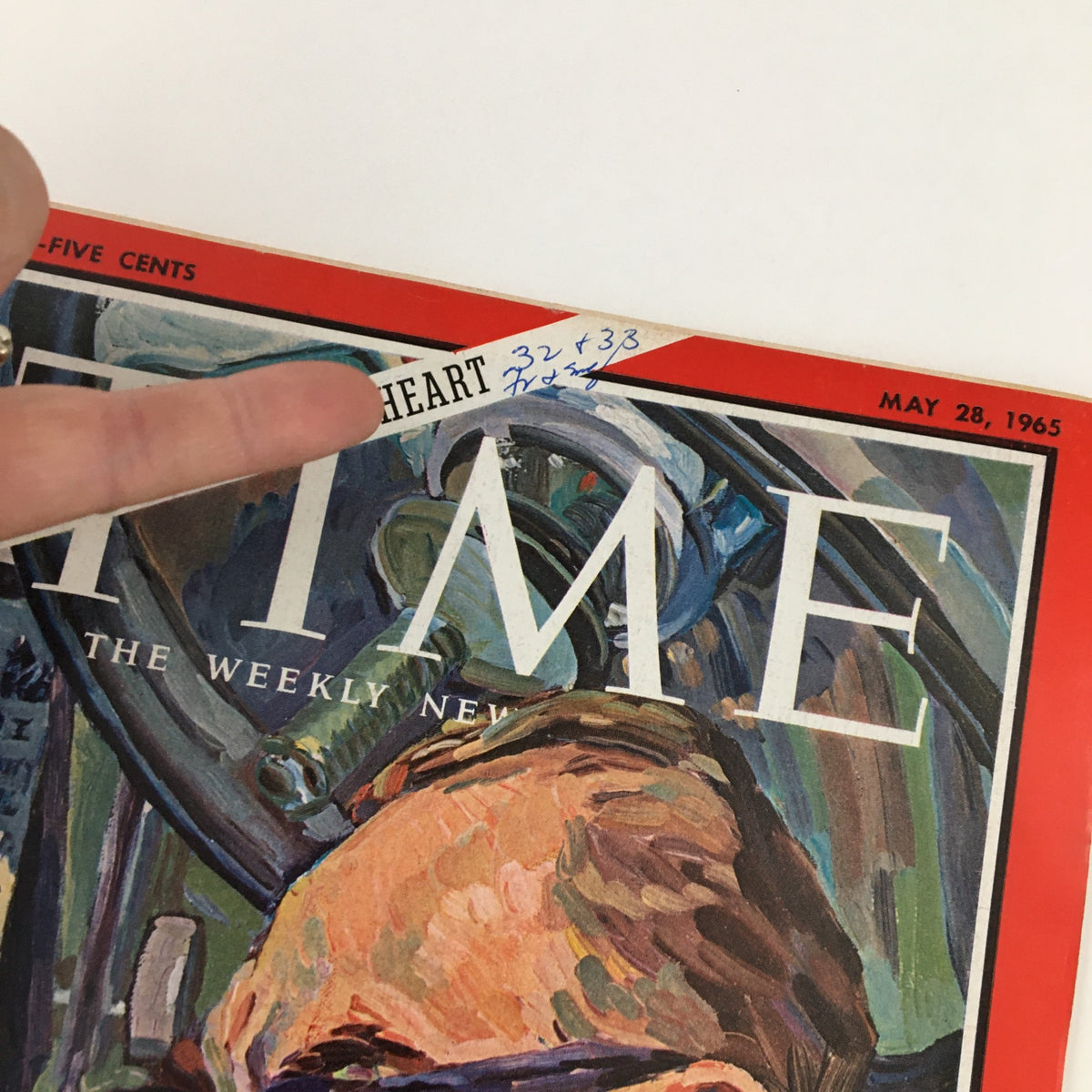 Close-up of the Time Magazine cover from May 28, 1965, showing the handwritten note '32 + 33' alongside the title 'Toward an Artificial Heart' and the name of surgeon Michael DeBakey.