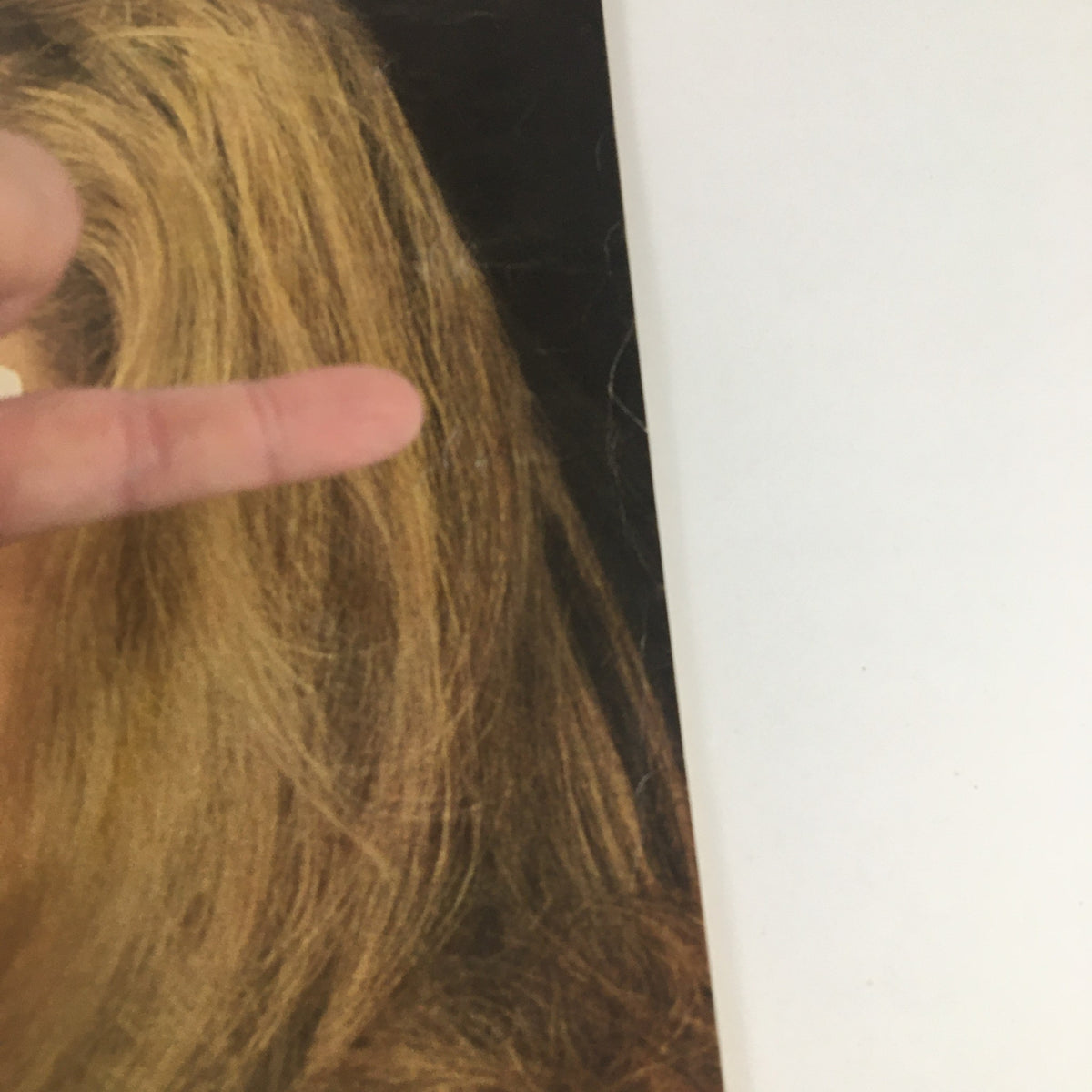 Close-up image of a hand with long blonde hair gesturing in Esquire Magazine July 1967 featuring an article on violence.