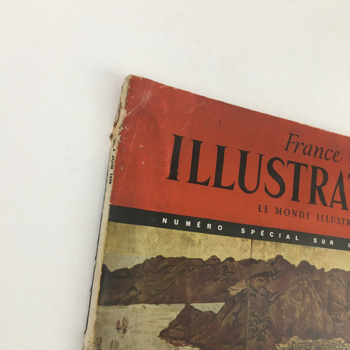 Edge view of France Illustration Magazine June 1949, revealing the magazine’s age and the vibrant red and yellow cover design.