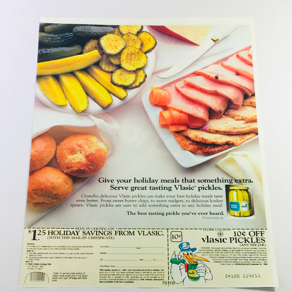 VTG Retro Vlasic Pickles Advertisement showcasing a holiday meal setting with various pickles, breads, and ham, including a coupon for holiday savings on Vlasic pickles.