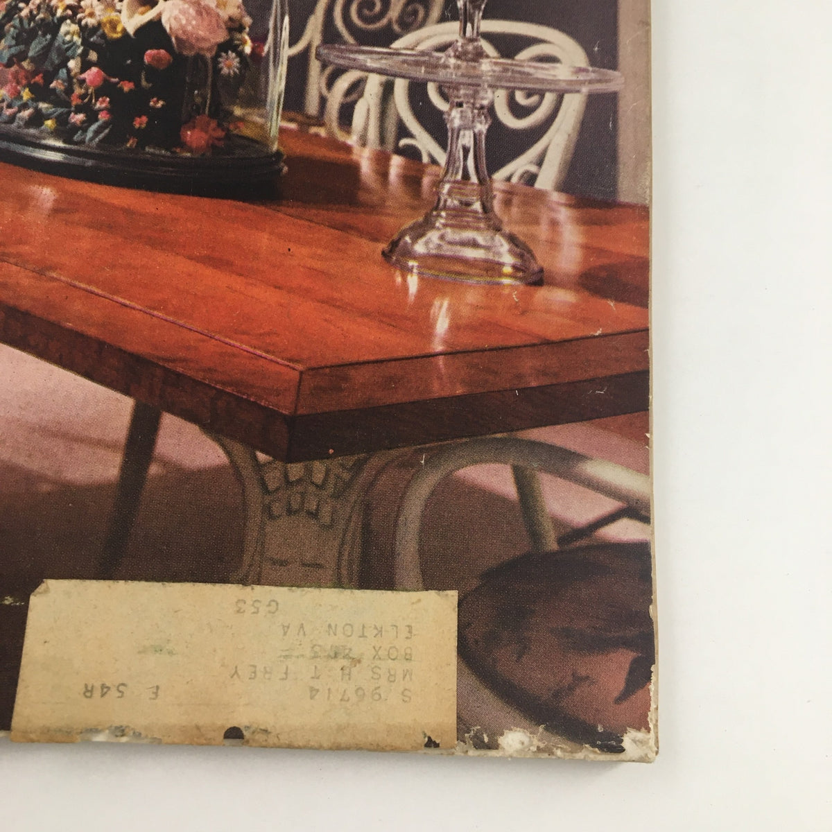 Cover image of The American Home Magazine September 1953 featuring a beautifully set wooden table with floral centerpiece and a glass cake stand.