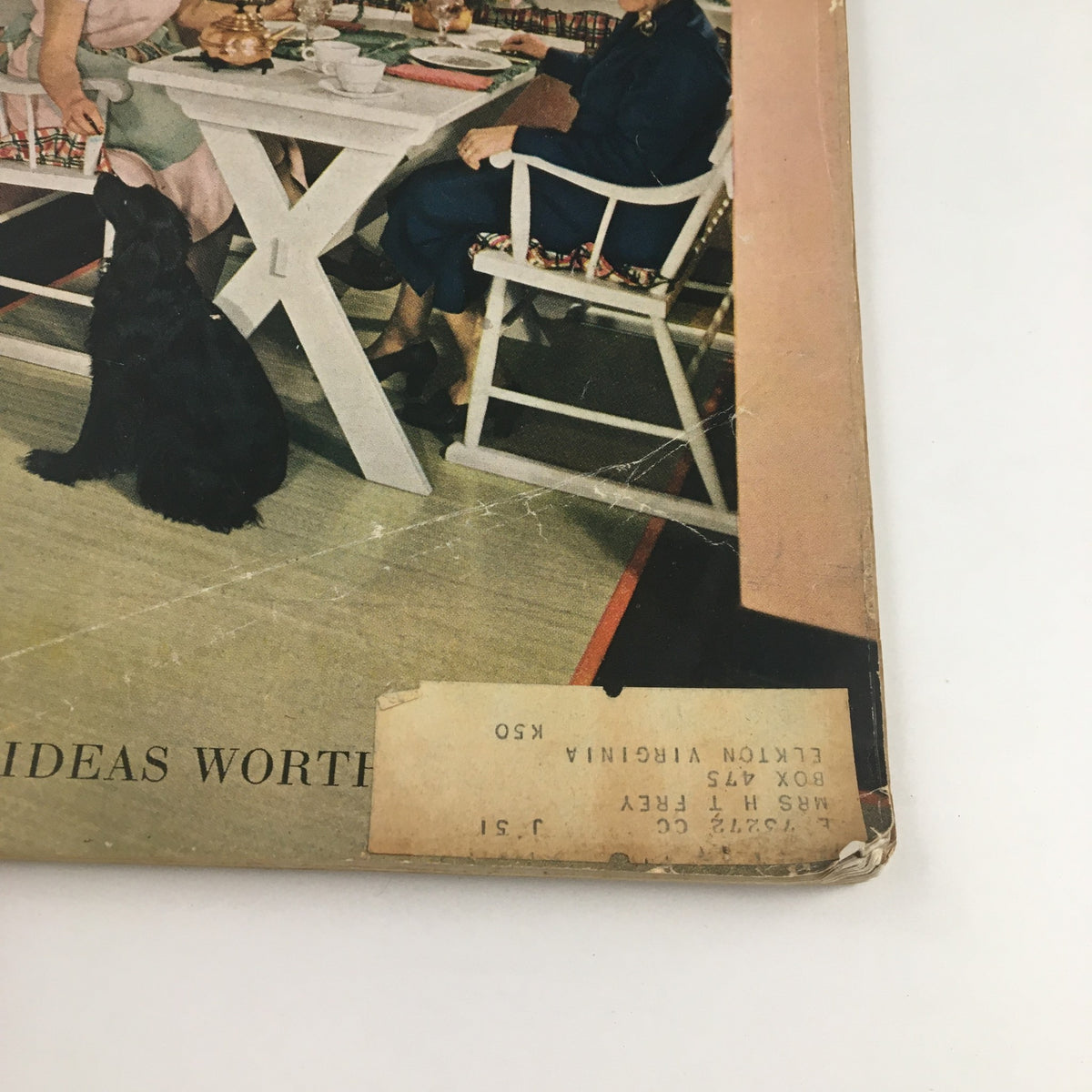 Detailed corner of The American Home Magazine March 1951 showing wear and a address label, reflecting its vintage authenticity.