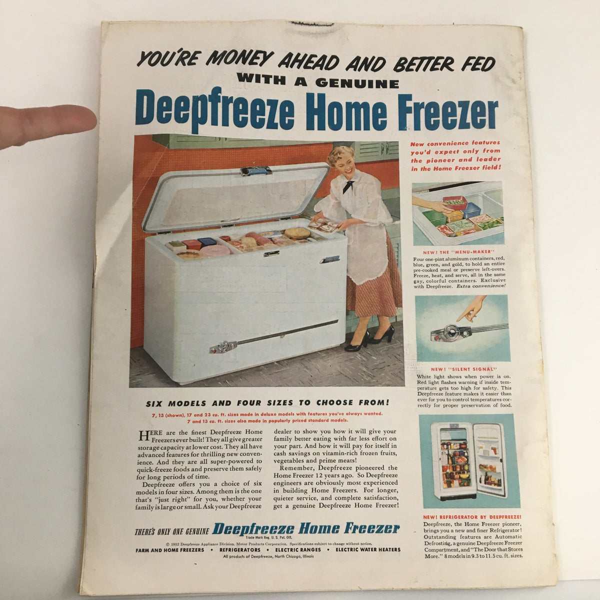 The American Home Magazine July 1952 cover showcasing an advertisement for the Deepfreeze Home Freezer featuring a woman presenting the freezer with various food items inside.