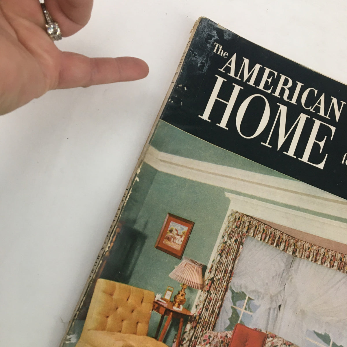 Side view of The American Home Magazine September 1952 showing its vintage cover and decorative elements.