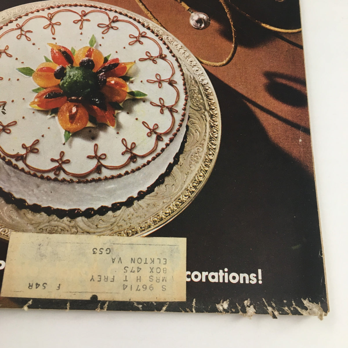 Detailed image of a beautifully decorated cake featured on the cover of The American Home Magazine December 1953, showcasing holiday designs.