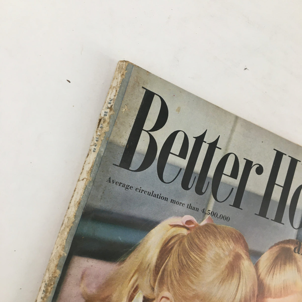 Top angle of Better Homes & Gardens March 1958 magazine showing the title and vintage wear, capturing the charm of culinary history in its article "Cheese Wanders from your Chafing Dishes."