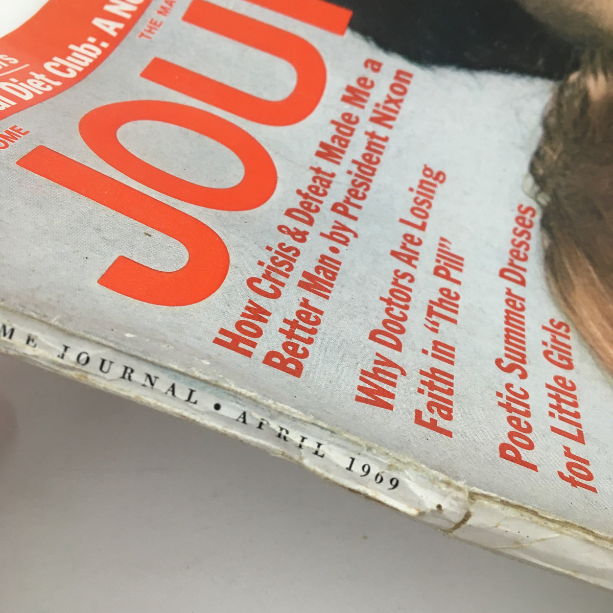 Close-up of the spine of the Ladies' Home Journal Magazine April 1969, displaying publication details and emphasizing its collectible status in good condition despite minor wear.