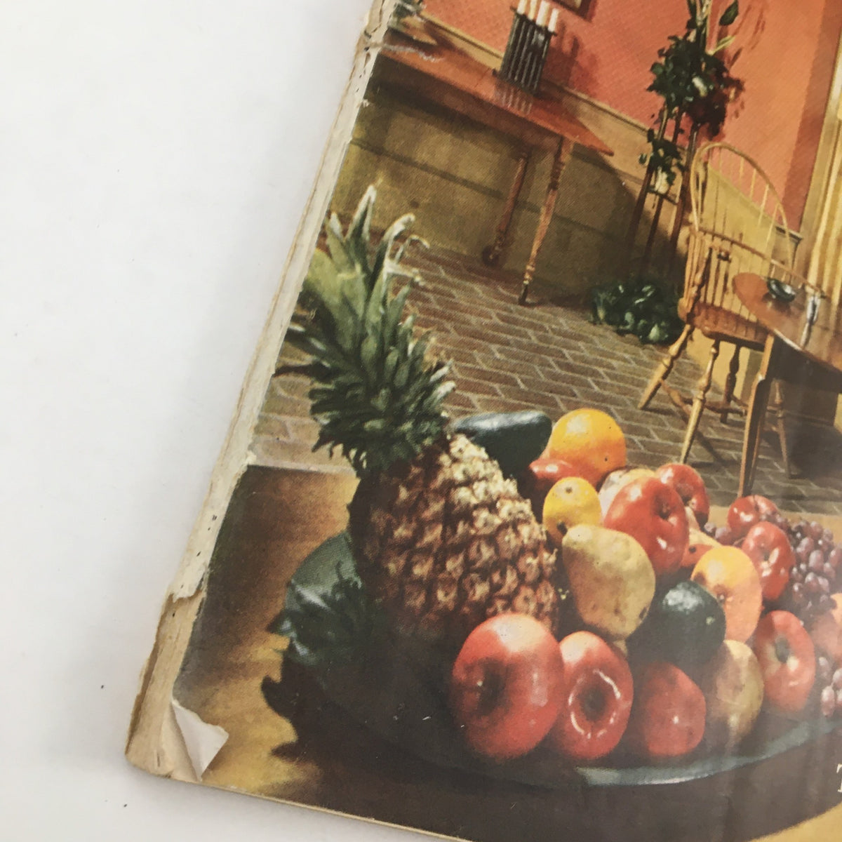 Close-up view of a fruit centerpiece on the Better Homes & Gardens February 1951 magazine cover showcasing fresh fruits.
