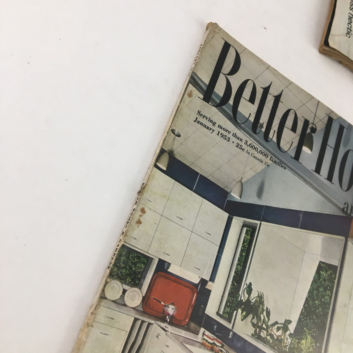 Side view of Better Homes & Gardens January 1953 magazine highlighting vintage kitchen aesthetics.