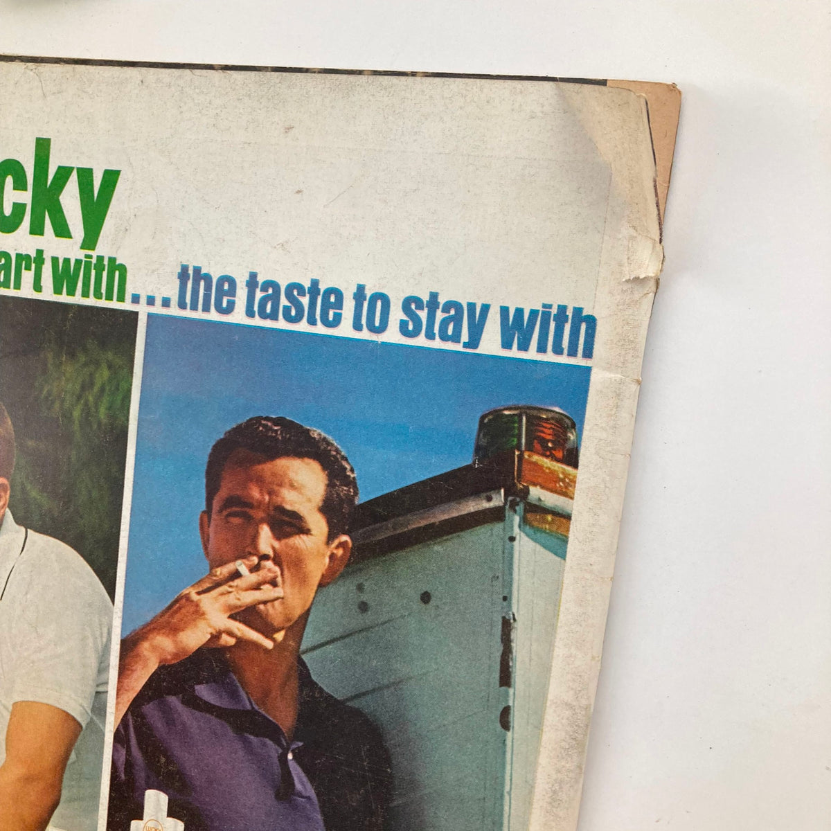 Detail of advertisement from VTG Life Magazine June 1 1962 for Lucky Strike cigarettes, showing a man holding a cigarette, emphasizing the product's appeal.