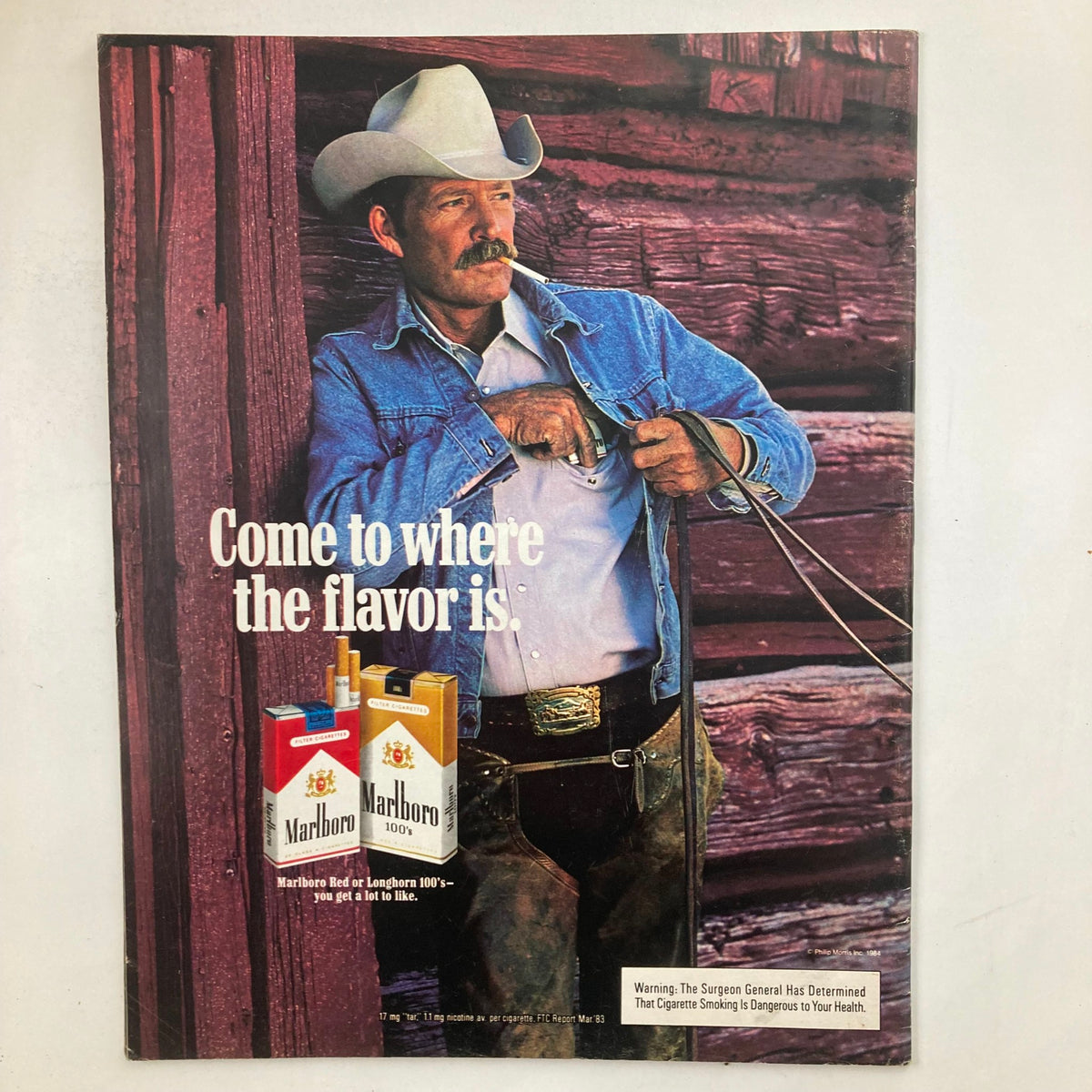 Vintage advertisement featuring a cowboy with a mustache in denim attire, promoting Marlboro cigarettes with the tagline 'Come to where the flavor is', highlighting the iconic lifestyle associated with the brand. Dated March 1984, related to VTG Life Magazine featuring film actress Daryl Hannah on the cover.