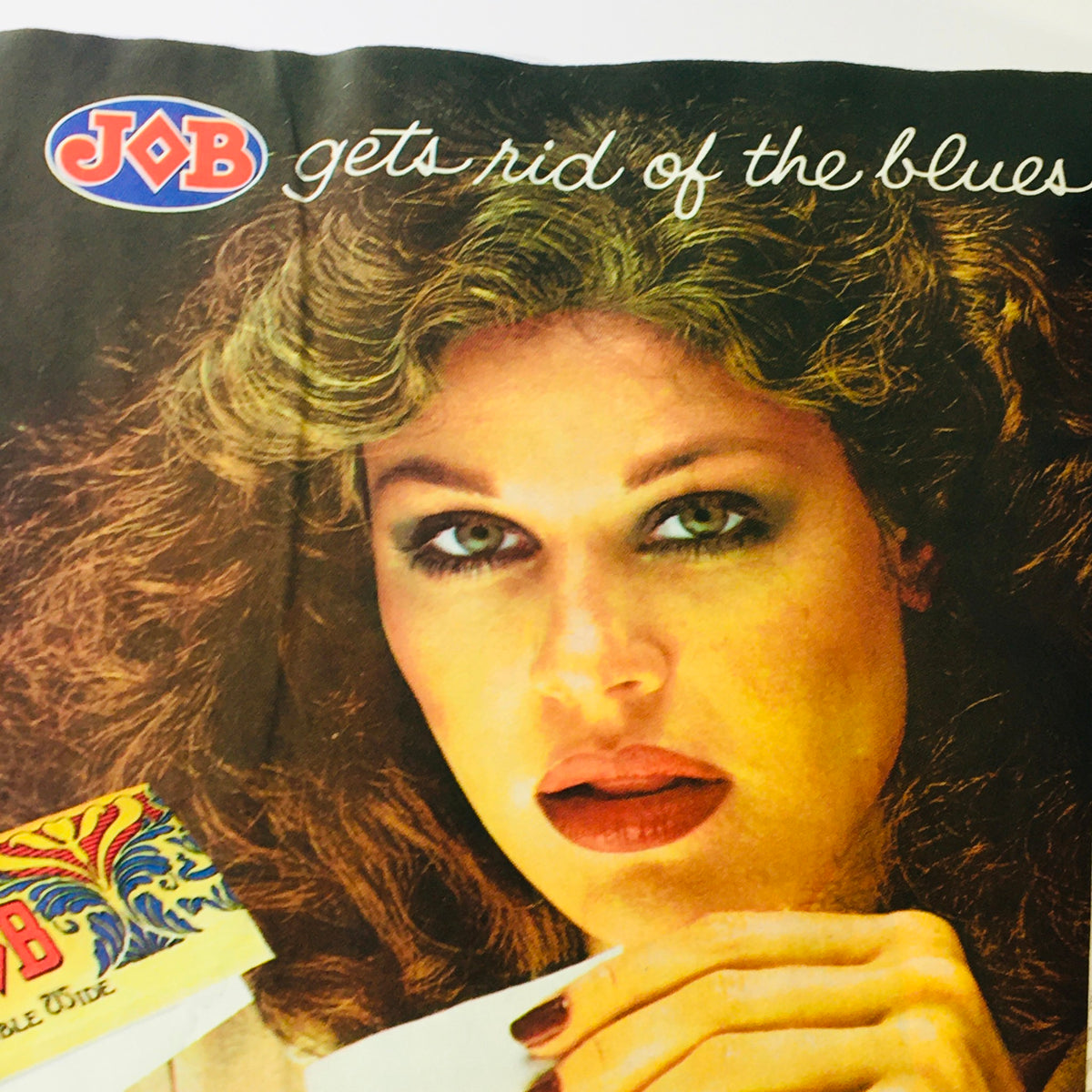 Close-up of a vintage advertisement for JOB rolling papers on the back cover of VTG High Times Magazine May 1978, featuring a model promoting the product.
