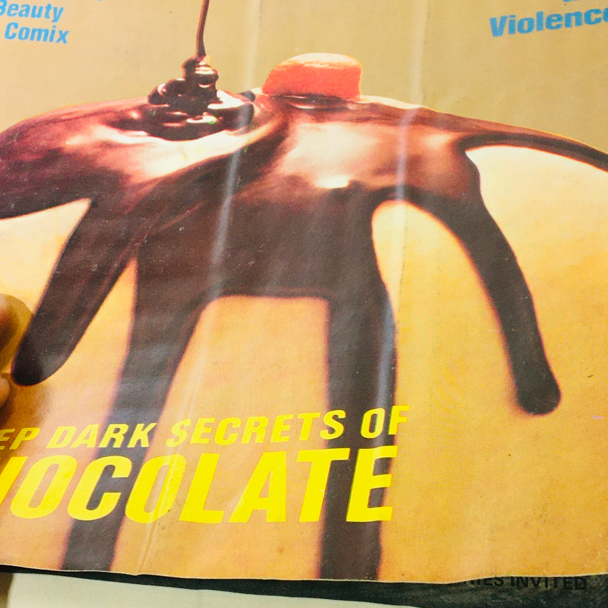 Close-up of the cover design from VTG High Times Magazine October November 1975 highlighting the deep dark secrets of chocolate, with an emphasis on the exclusive interview with the Dalai Lama.