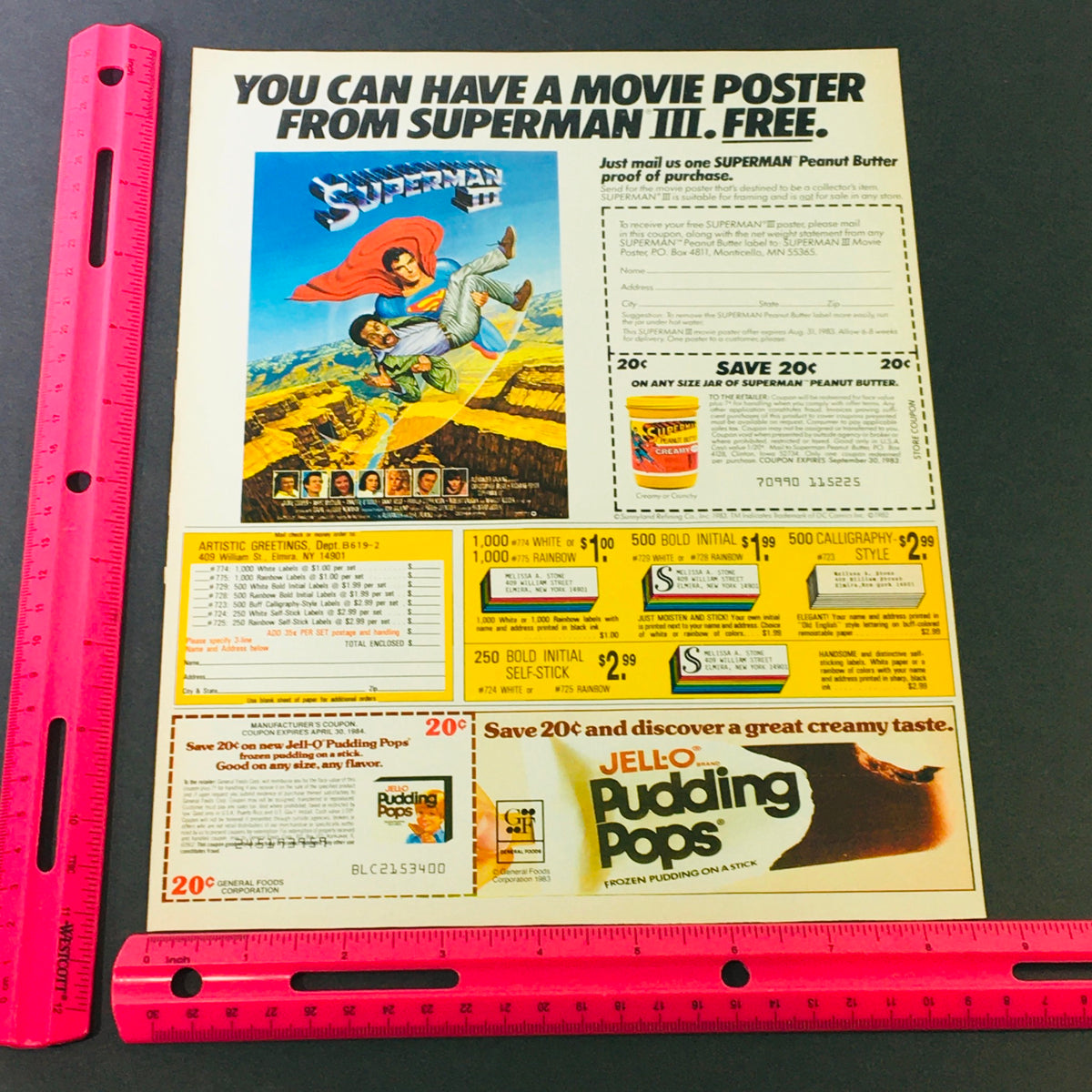 VTG Retro 1984 Christopher Reeves Superman 3 Free Poster Peanut Butter Ad Coupon displayed with a ruler for scale, showcasing the Superman III promotional offer and other coupons.